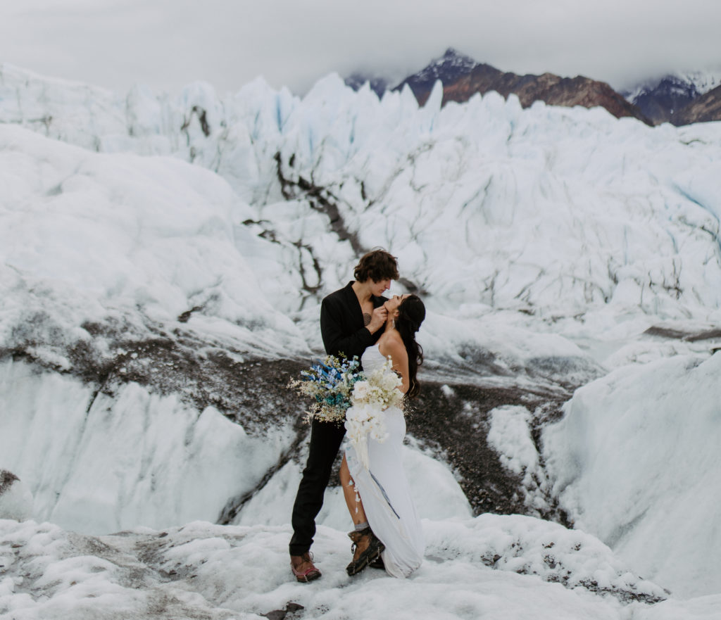 couple eloping on a glacier