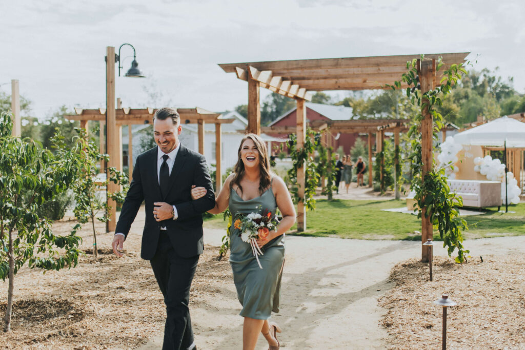 bridal party walking down aisle during outdoor wedding ceremony