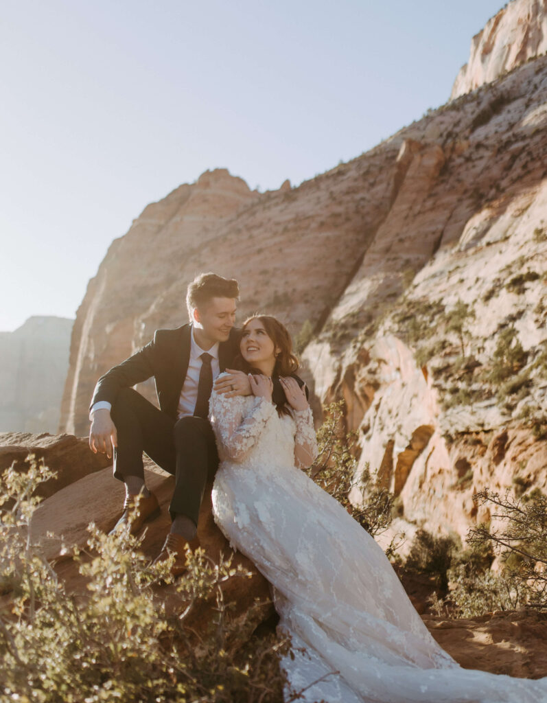 Couple sits in zion national park after getting married