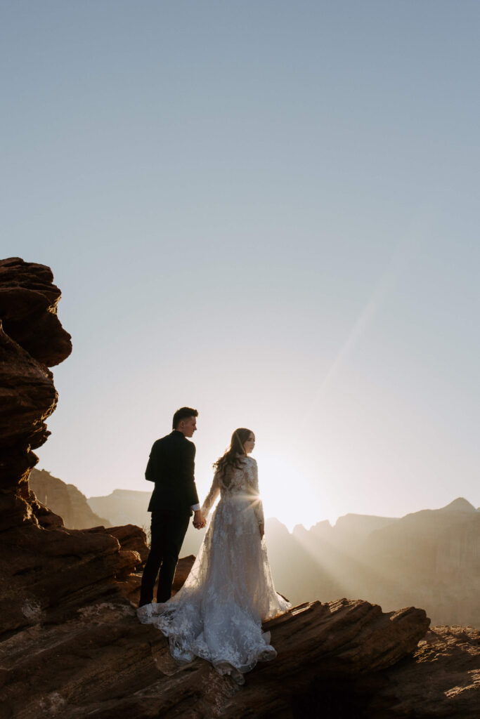 bride and groom at stunning overlook in zion national park