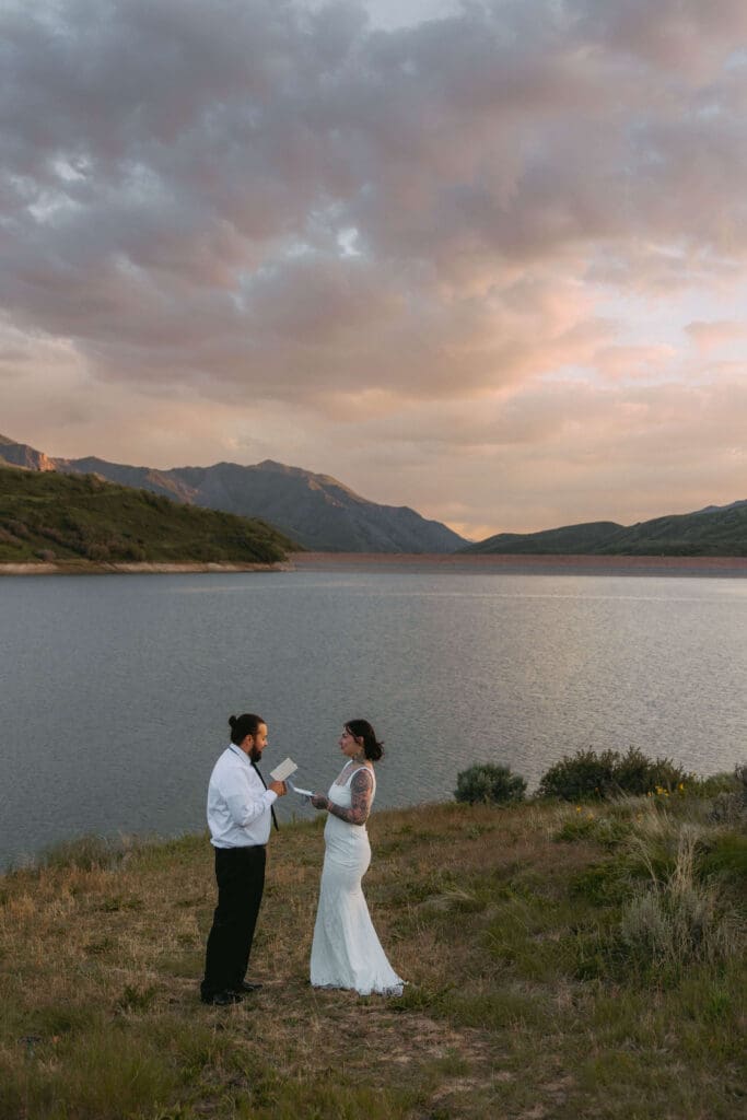 bride and groom say 'i do' in the mountains