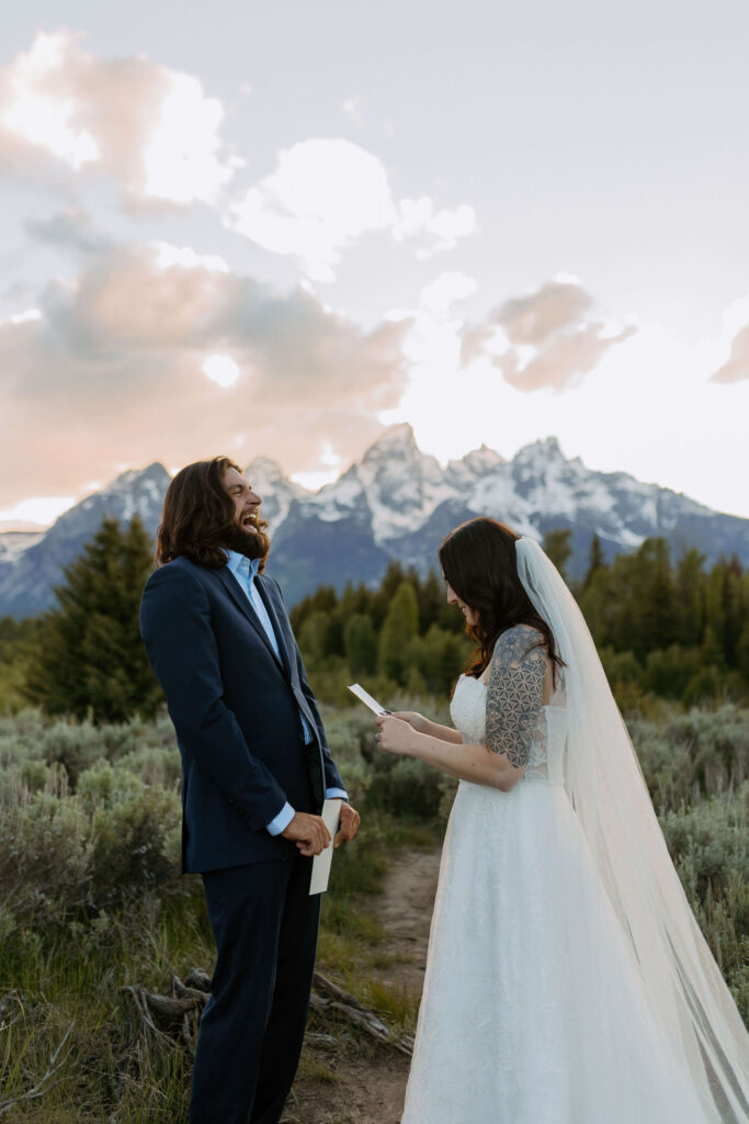 bride and groom reading vows in grand teton national park