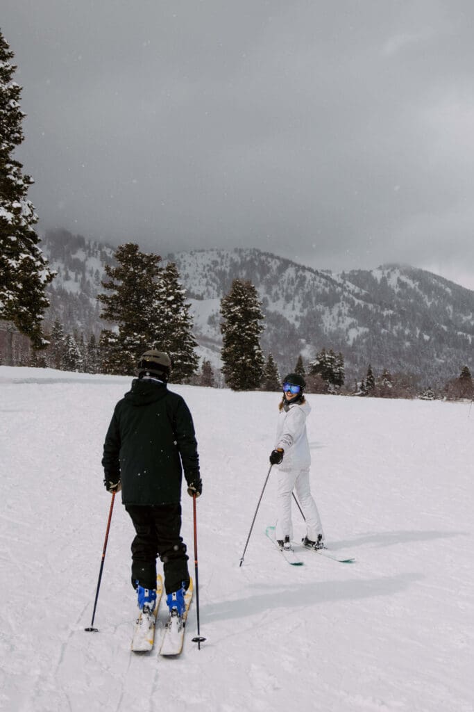 Bride and groom hit the slopes at Snowbasin Ski Resort on their winter wedding day.
