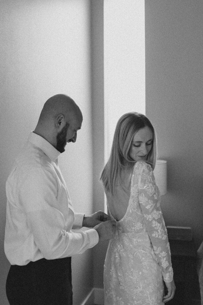 bride and groom get ready together on their winter elopement day