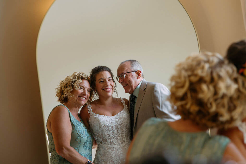bride gets ready with parents
