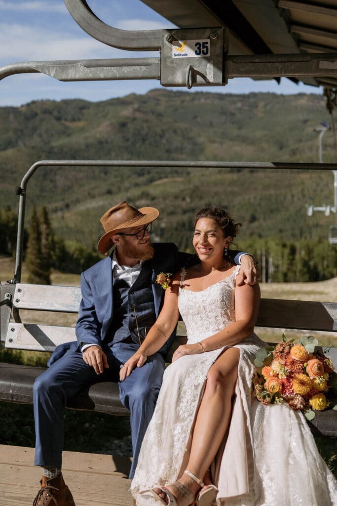bride and groom on chairlift at solitude mountain resort wedding
