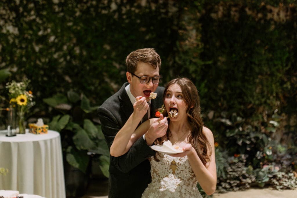 bride and groom cut cake at red butte garden
