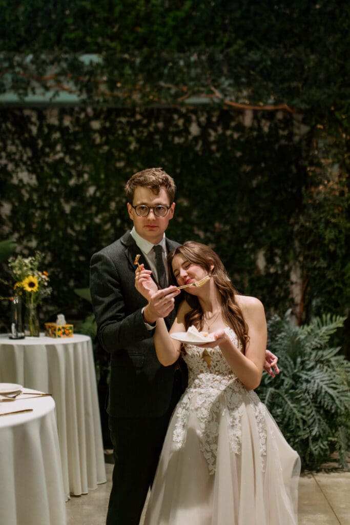 bride and groom cut cake at red butte garden