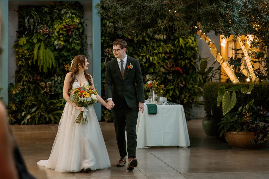 bride and groom walking down the aisle at red butte garden