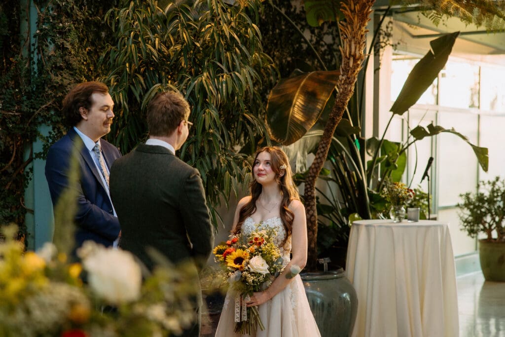 bride and groom get married in red butte garden orangerie