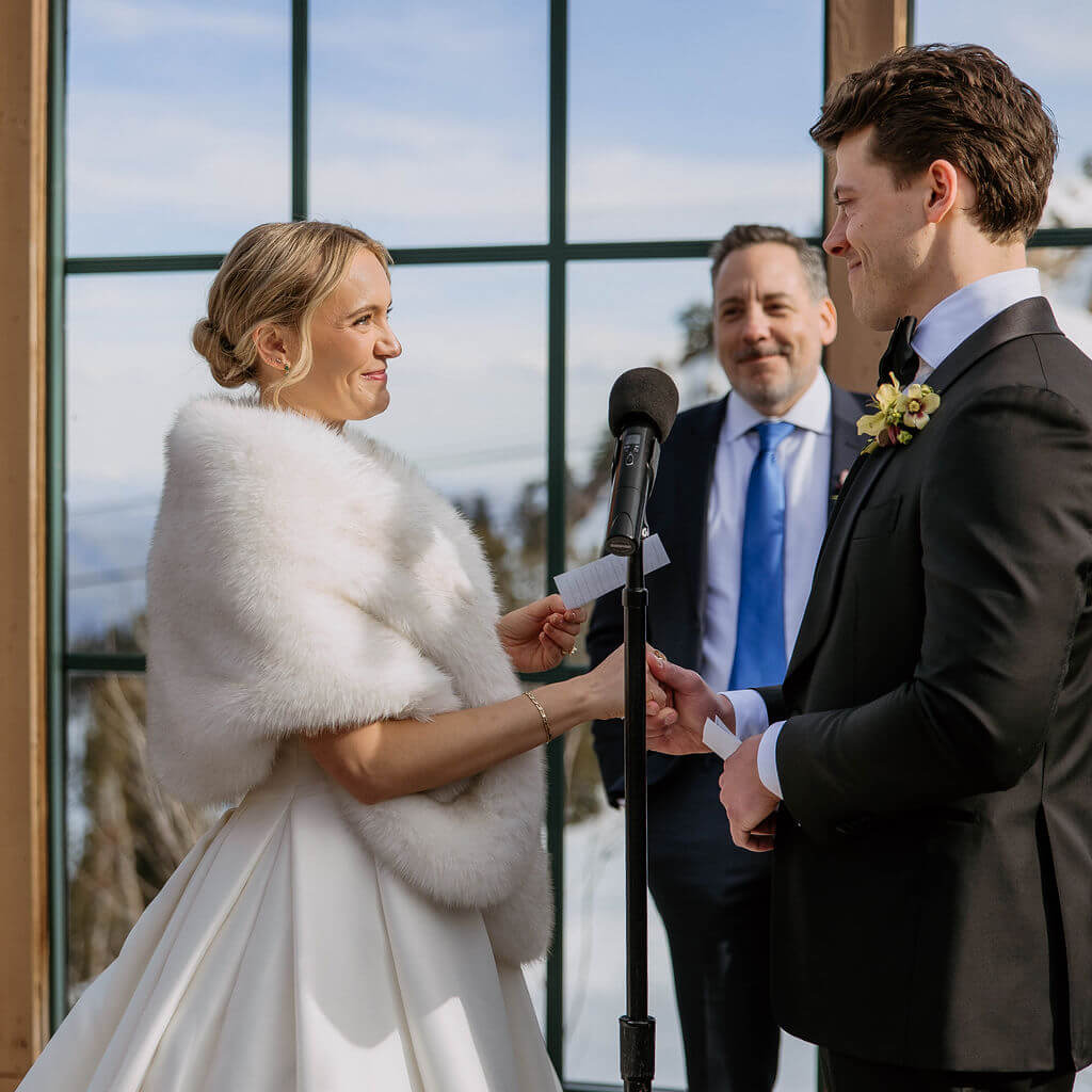 bride and groom read vows at snowbasin wedding