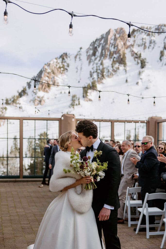 bride and groom first kiss at snowbasin resort