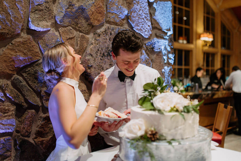 bride and groom cut the cake at snowbasin resort