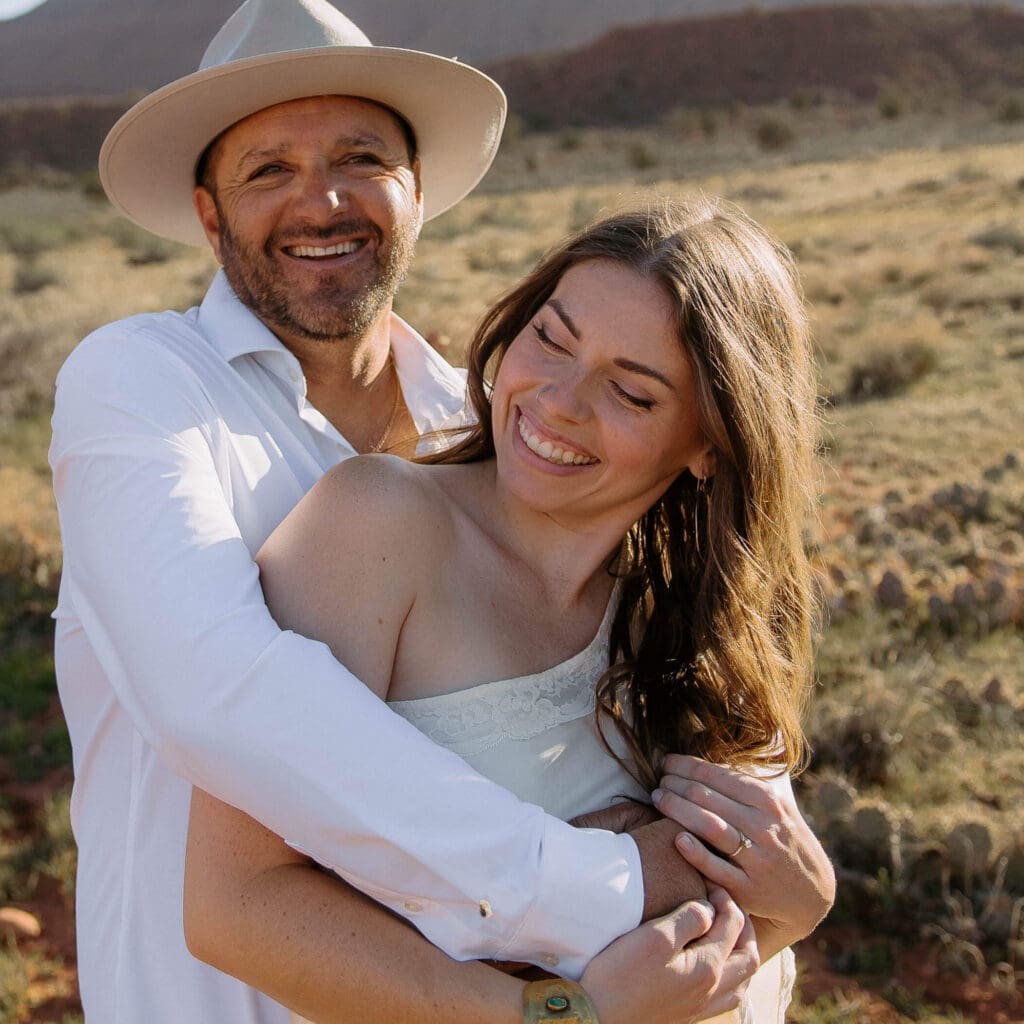 western bride and groom laughing