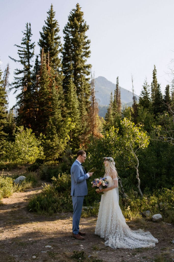 bride and groom read vows at utah elopement