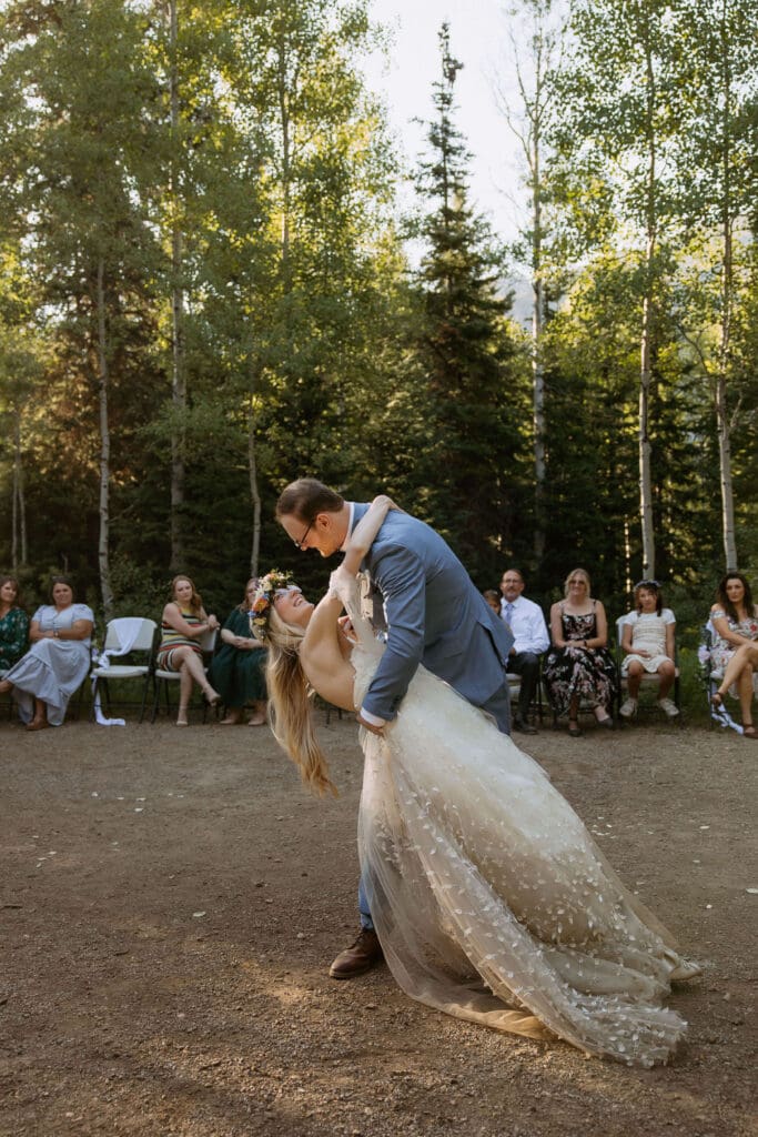 bride and groom dance at campground wedding in utah
