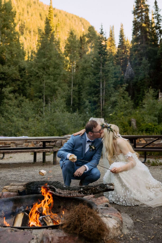 bride and groom make s'mores on their wedding day