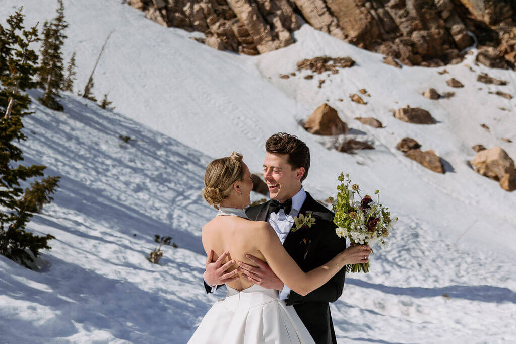 bride and groom in the snow 
