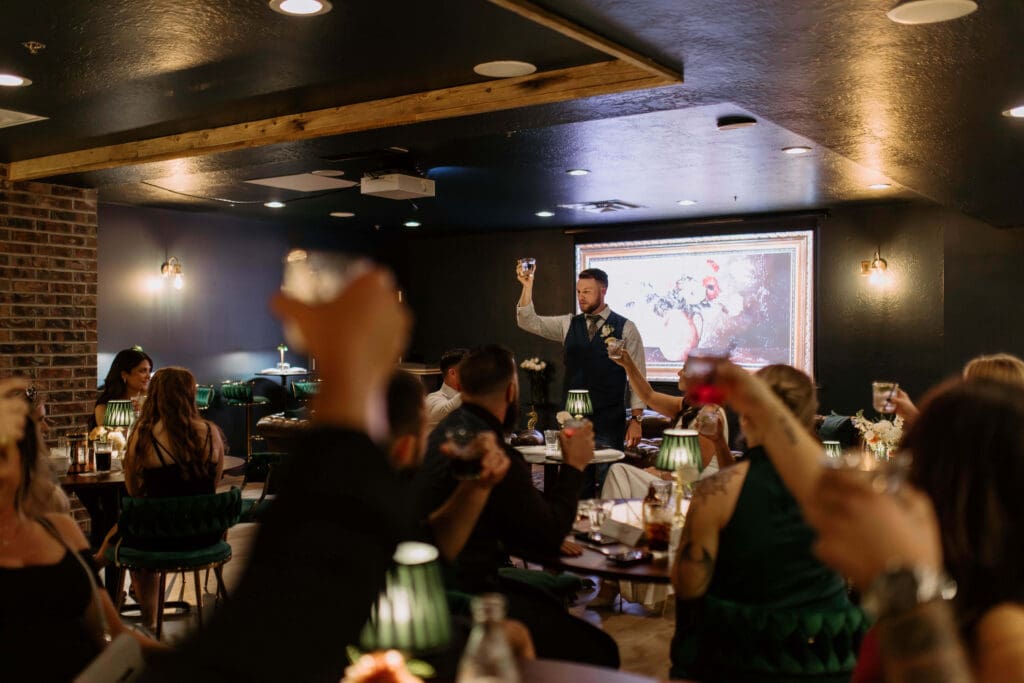 toasts at small wedding reception after elopement in utah 