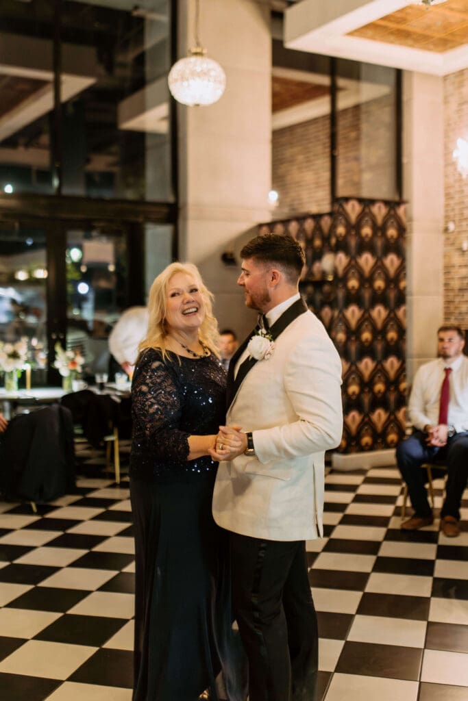 groom dances with mom at small wedding reception venue in utah