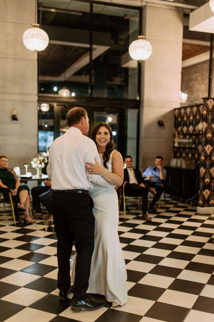 bride dances with dad at small wedding reception venue in utah