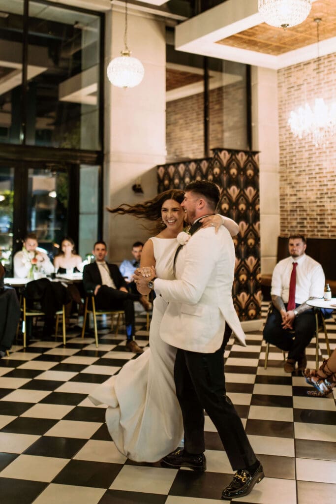 bride and groom first dance at small wedding reception venue in utah