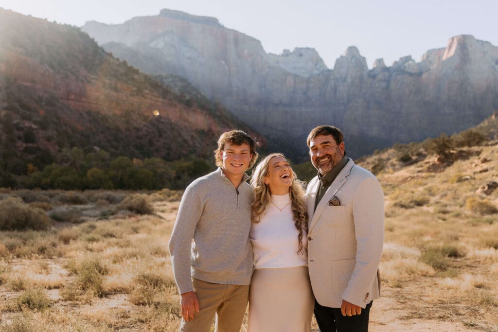 bride, groom, and their son after intimate elopement at nature center north lawn in zion national park