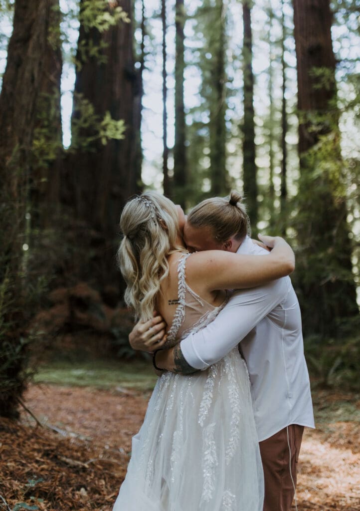 bride and groom hug during intimate elopement day in the redwoods