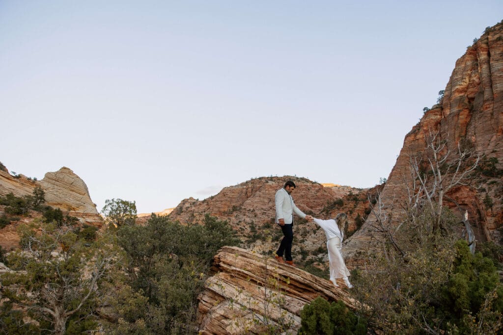 bride and groom hiking on their intimate elopement day in zion national park