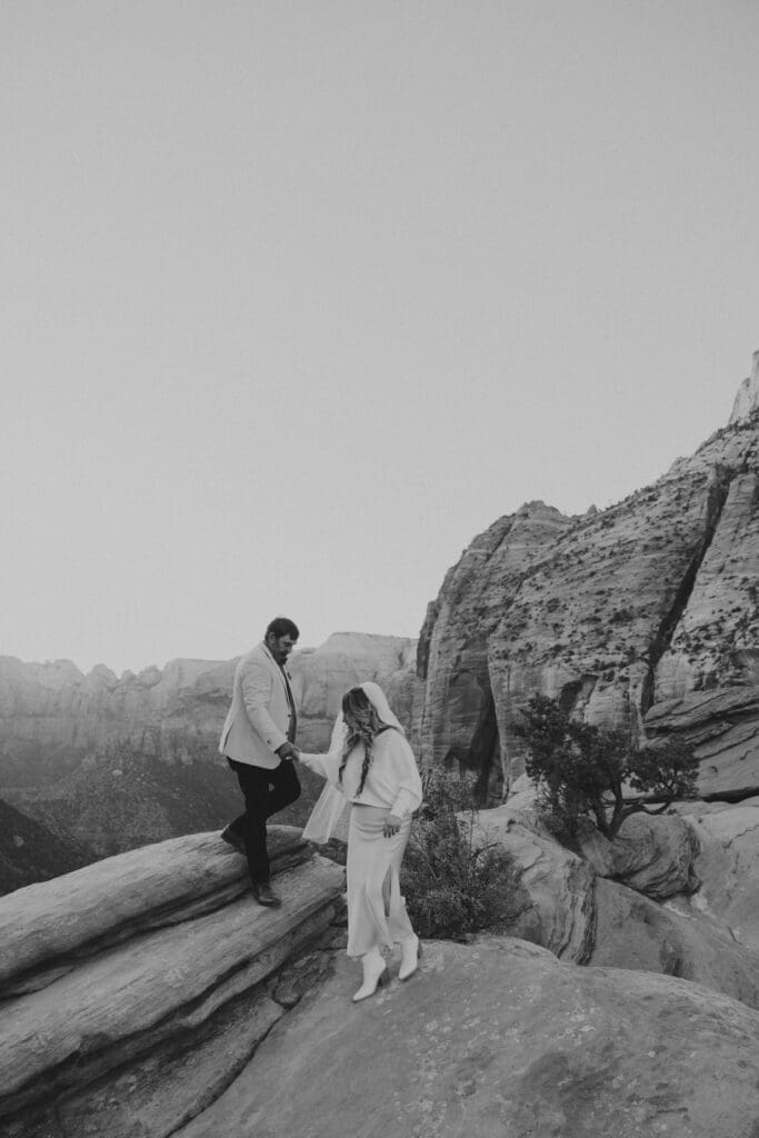 bride and groom hike on their elopement day