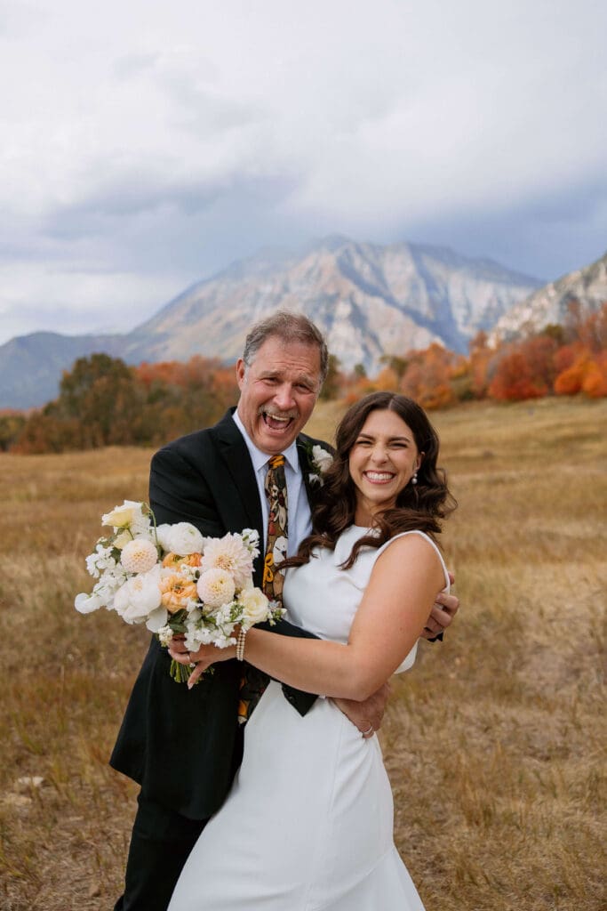 bride and her dad after mountain wedding