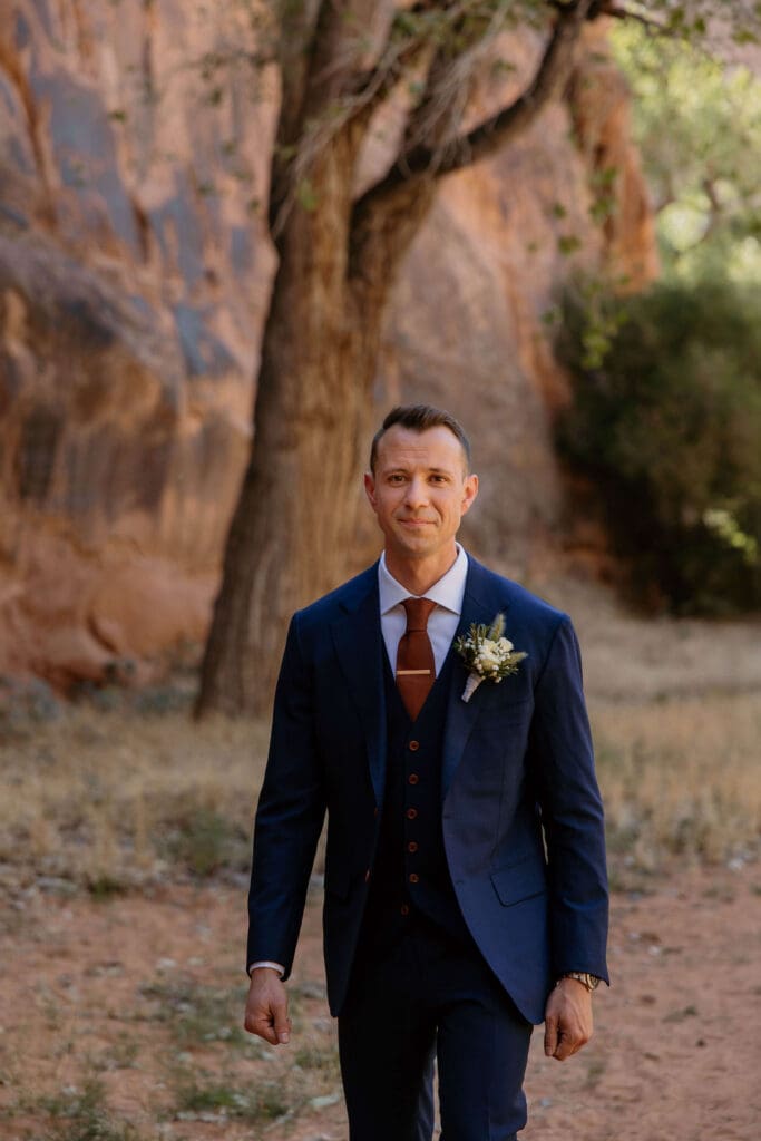 groom walking down aisle at moab wedding