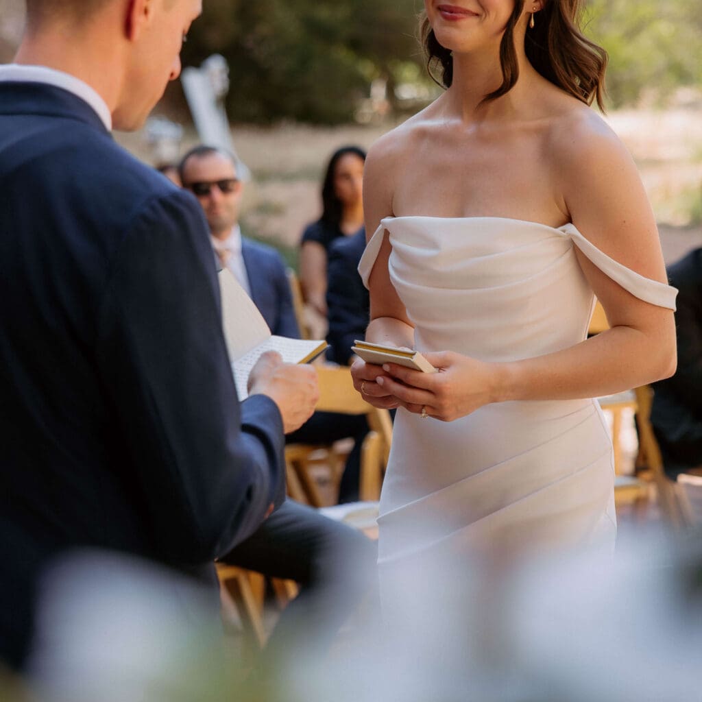 bride and groom read vows at moab wedding